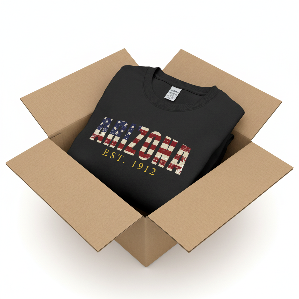 Black t-shirt in shipping box with collar visible