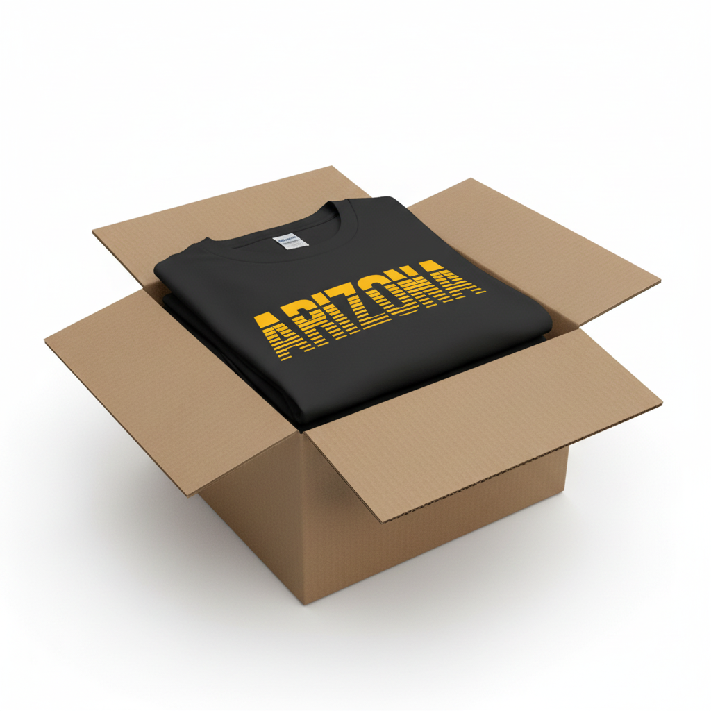 Black t-shirt in shipping box with collar visible