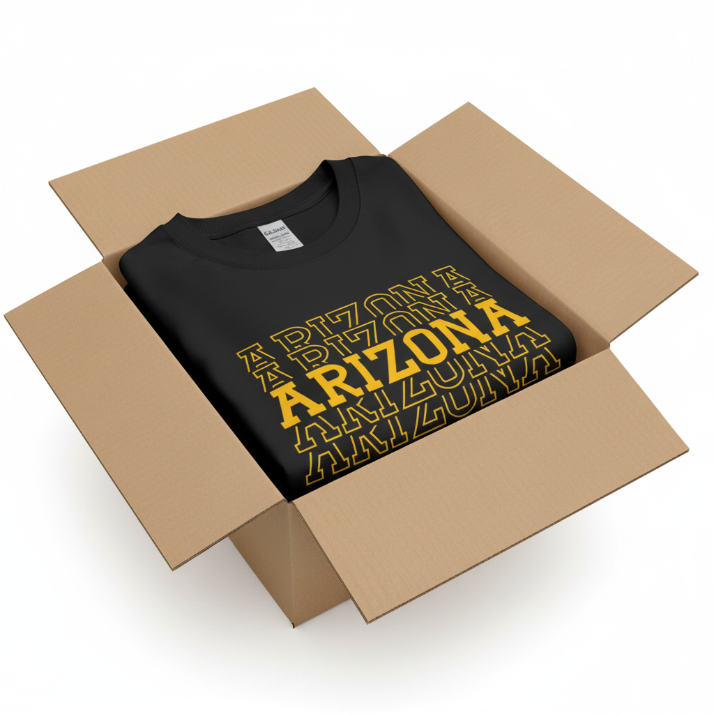 Black t-shirt in shipping box with collar visible